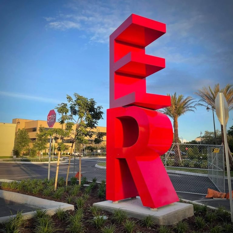 ER sign in red in front of a hospital